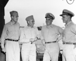 Lieutenant May, Rear Admiral Arthur Struble, Rear Admiral Daniel Barbey, and Lieutenant Commander William Mailliard at Hollandia, New Guinea, Nov 1944