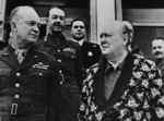 Dwight Eisenhower and Winston Churchill in Tunisia, 25 Dec 1943, photo 2 of 2; Churchill was in a robe in this photo because he was recovering from pneumonia