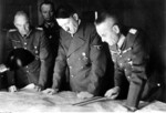 Franz Halder (right) briefing Adolf Hitler (center) on the situation on the Eastern Front at the headquarters of Walther von Brauchitsch (left), Aug 1941