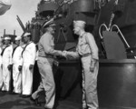 Fleet Admiral Nimitz and Admiral Halsey shaking hands aboard battleship USS South Dakota, Tokyo Bay, Japan, 29 Aug 1945