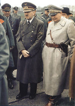 Adolf Hitler and Hermann Göring at the demonstration of the newly developed Hetzer tank destroyer at a closed highway near Schloss Klessheim west of Salzburg, German occupied Austria, 20 Apr 1944; note Karl-Heinrich Bodenschatz (left of photo, showing full face), Wilhelm Keitel (left of photo, red lapel), and Ferdinand Porsche (right of photo, black hat) in background