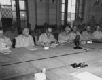 Admiral Thomas Kinkaid (with glasses) and Lieutenant General John Hodge signing the Japanese surrender document, General Government Building, Seoul, Korea, 9 Sep 1945