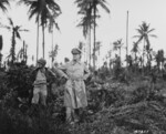 General Douglas MacArthur and his acting aide Colonel Lloyd Lehrabas inspecting the results of the heavy naval bombardment on Los Negros, Admiralty Islands, 29 Feb 1944