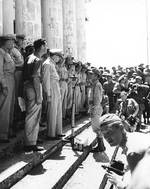 Guerilla leader Ruperto Kangleon reports to Douglas MacArthur at Leyte liberation ceremony, Tacloban, Philippines, 23 Oct 1944