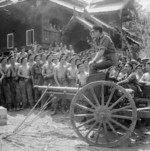 Louis Mountbatten addressing men of British Royal Armoured Corps atop a captured Japanese 75mm gun, Mandalay, Burma, 21 Mar 1945