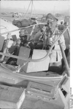 Erwin Rommel having a meal in the field in his SdKfz. 250/3 command vehicle 