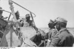 Erwin Rommel in conversation with his men from his command vehicle SdKfz. 250/3 