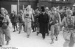 Otto Skorzeny escorting Benito Mussolini to the aircraft which would extricate him from the Hotel Campo Imperatore in Gran Sasso, Italy, 12 Sep 1943