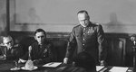 Georgy Zhukov reading the act of the German surrender, with Arthur Tedder seated next to him, Berlin, Germany, 8 May 1945