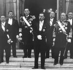 Japanese Prime Minister Fumimaro Konoe with his cabinet ministers, Tokyo, Japan, 7 Mar 1937; note Minister for Foreign Affairs Koki Hirota (left edge of photograph) and Minister for Navy Mitsumasa Yonai (rear row in naval uniform)