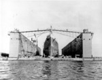 USS ABSD-1 with USS Columbia in the dock, Espiritu Santo, New Hebrides, Jan 1944