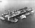 USS ABSD-2 at Seeadler Harbor, Manus, Admiralty Islands, Apr-May 1945. Note the Liberty-class ship and seaplane tender in the dock. This shows almost the same angle of approach during the torpedo attack on the drydock on 29 Apr 1945.