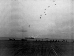 USS Corregidor firing on Japanese aircraft off Saipan, Mariana Islands, 17 Jun 1944; seen from the flight deck of USS Coral Sea