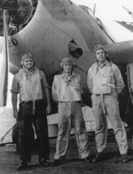 Aviation Radioman 2nd Class S. Bleier, Aviation Ordnanceman 2nd Class H. R. Thompson, and Lieutenant R. S. Evarts aboard USS Coral Sea, 30 Oct 1943