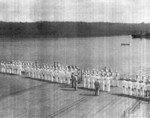 Captain Paul W. Watson of USS Coral Sea inspecting the A Division on the flight deck, 27 May 1944