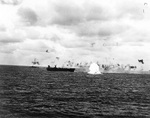 A Japanese aircraft crashed into the sea near carrier Belleau Wood in the Mariana Islands, 23 Feb 1944; photo taken from USS Essex