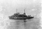 Port quarter view of Biscayne in her original configuration with a large crane and clear fantail, Boston Navy Yard, Massachusetts, United States, 19 Jan 1942; note OS2U Kingfisher aircraft on tail