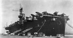 USS Copahee in port in the United States with Dauntless dive bombers on her flight deck, 10 Apr 1944; note she was wearing Camouflage Measure 21