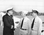 US Navy Cmdr Marshal Austin welcoming submariners Lt Cmdr Philip Eckert and Lt (jg) William Wingate, both of USS Gar, to Mare Island Naval Shipyard, California, United States, Aug 1945