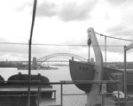 HMAS Hobart in Sydney Harbor, Australia, 20 Mar 1947; note Sydney Harbour Bridge in background; photograph taken from aboard USS Currituck