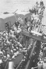 Survivors of USS Helena being transferred from destroyer USS Nicholas to cruiser USS Honolulu, Tulagi, Solomon Islands, 6 Jul 1943, photo 1 of 3