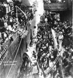 Survivors of USS Helena being transferred from destroyer USS Nicholas to cruiser USS Honolulu, Tulagi, Solomon Islands, 6 Jul 1943, photo 2 of 3