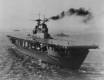 Carrier Hornet, probably at a US east coast port, circa late 1941; note ferry boat and 