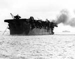 Independence showing atomic bomb damage off Bikini Islands, 1 Jul 1946, photo 1 of 2