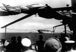 Seaplane tender Langley being abandoned after being damaged by Japanese bombs, south of Java, 27 Feb 1942; destroyer Edsall by Langley