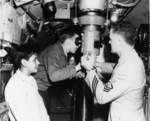 Visitors looking through the periscope of USS Macabi at Mare Island Naval Shipyard, California, United States, Armed Forces Day, 19 May 1956