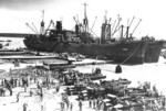 USS Aquarius (AKA-16) and USS Titania (AKA-13) unloading United States Marines at Pavuvu, Russell Islands, Solomon Islands, 28 Apr 1944