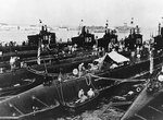 Submarines Salmon, Seal, Pickerel, Plunger, Snapper, and Permit, San Diego harbor, California, United States, 1940; note carrier Enterprise in background