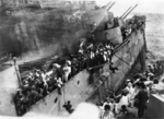 Crew of HMS Prince of Wales escaping from the sinking battleship, off Malaya, 10 Dec 1941