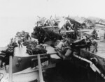 USS Birmingham grinding up to damaged USS Princeton while the crew assisted with damage control efforts, Philippine Sea, 24 Oct 1944