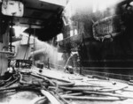 USS Birmingham assisting with firefighting of USS Princeton, seen from foredeck of USS Birmingham, Philippine Sea, 24 Oct 1944