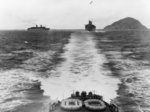 RMS Queen Mary (right), RMS Queen Elizabeth (left), and HMAS Sydney (foreground) off Wilson