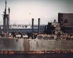 USS President Adams (foreground) and USS Quincy (background), Nouméa Harbor, New Caledonia, 4 Aug 1942; note many Marines aboard USS President Adams