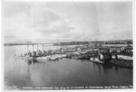 20 R-class submarines of US Navy Submarine Divisions 9 and 14 at Pearl Harbor, US Territory of Hawaii, 12 Dec 1930. Note the repair piers and floating crane YD-25 in the distance.