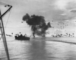 USS President Jackson (left of photograph), USS San Francisco (background center) during the Naval Battle of Guadalcanal, 12 Nov 1942; the column of smoke in the background astern of USS San Francisco was from a downed Japanese aircraft