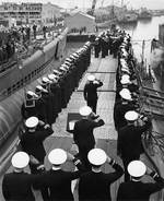 The National Ensign raised aboard submarine Skate, Mare Island Navy Yard, Vallejo, California, United States, 15 Apr 1943; Seahorse at left & Sargo at right