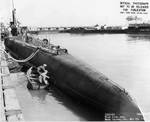 Workers paintingin the hull of USS Searaven during an overhaul, Mare Island Navy Yard,  Vallejo, California, United States, 13 May 1943