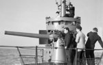 Crew of HMS Sunfish practice on the 76-mm (3-in) deck gun while skipper Lt. Hilary John Bartlett watched, Portsmouth, Hampshire, England, UK, 4 Nov 1943