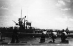 USS Sunfish flies her battle flag as she departs Pearl Harbor, US Territory of Hawaii, 29 Aug 1945; USS Pompon in foreground, photo taken from USS Pipefish