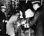 Mrs. Frederick Crisp christening submarine Tunny, Mare Island Naval Shipyard, Vallejo, California, United States, 30 Jun 1942; Commander Lemuel Padget and Rear Admiral W. L. Friedell were also present