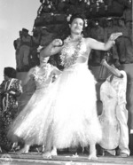 Hula dancers entertain returning Japanese-American veterans of US 442nd Regimental Combat Team aboard Victory Ship USS Waterbury Victory, Honolulu, US Territory of Hawaii, 9 Aug 1946; photo 1 of 7