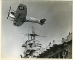 Spitfire Mk. Vc-Tropical variant from No. 603 Squadron RAF being hauled aboard USS Wasp (Wasp-class) by a crane, Glasgow, Scotland, United Kingdom, 13 Apr 1942, photo 2 of 3