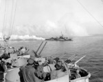 USS Cony laying smoke screen near USS West Virginia (foreground), off Leyte, Philippines, Oct 1944; note 20mm Oerlikon and 40mm Bofors weaponry aboard West Virginia