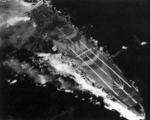 Carrier Zuiho damaged during Battle off Cape Engaño, 25 Oct 1944; note battleship camouflage; as seen on page 68 of US Navy War Photographs