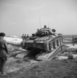 Covenanter tank of 6th Guards Armoured Brigade, British Guards Armoured Division crossing a scisssors bridge laid down over an anti-tank ditch, Tilshead, Wiltshire, England, United Kingdom, 25 Jun 1942