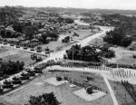 Japanese surrender ceremony at the headquarters of US 10th Army, Okinawa, Japan, 7 Sep 1945; note Japanese guns by flagpole, US M26 heavy tanks lower left, US self-propelled guns upper left